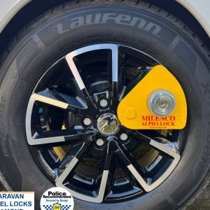 Milenco Alpha wheel lock fitted to a caravan — Sold Secure rated wheel clamp – How Milenco Alpha Diamond Wheel Lock 7757 – Yellow – Caravan Security Clamp Protects Your Caravan from Theft